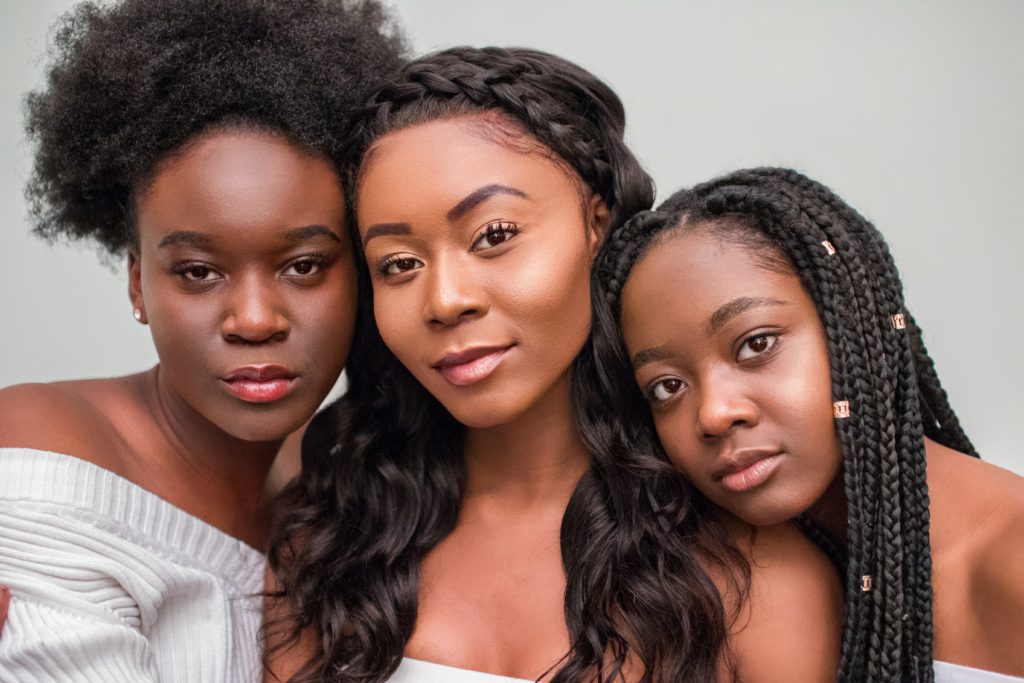 Three content Black women with natural hair after overcoming anxiety