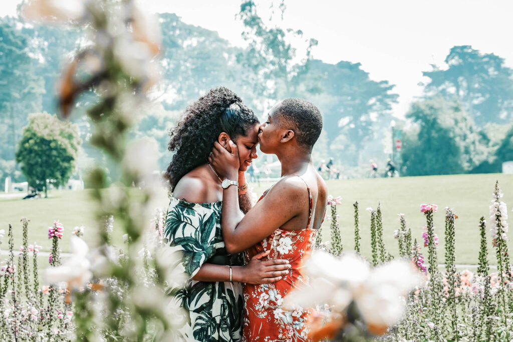 Image of a person kissing another person on the head while standing outside. Prepare enrich premarital counseling helps you build the type of relationship that you want before you get married. With the support of an Atlanta premarital counselor you can get the intimacy and happiness like the couple in the photo.