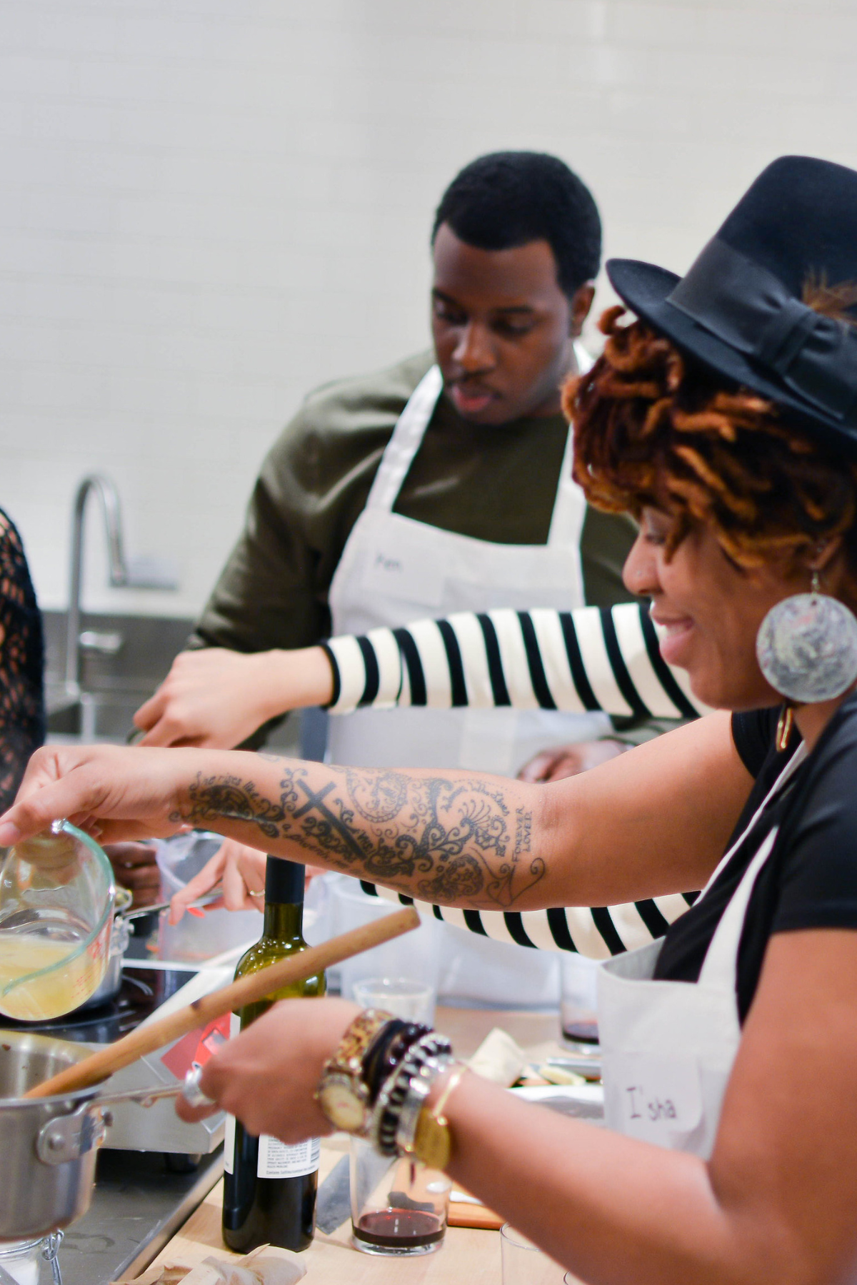 Image of a black family cooking a holiday meal. Representing something that can cause stress to mental health in the black community in Atlanta. However you can be joyful like the people in the photo with guidance of an Atlanta therapist in therapy for black people.