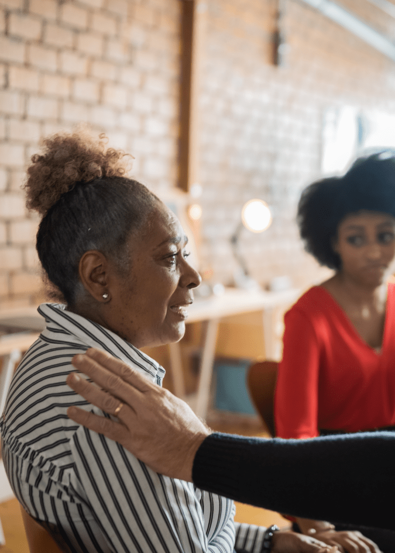 Lending a hand to a group member in in Atlanta group therapy, creating connections and empowering each other